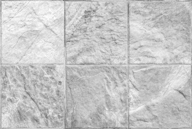 istock Closeup surface brick marble stone wall texture background in black and white tone 985458750