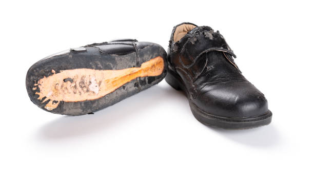 istock pair of damaged old one on white 985464200