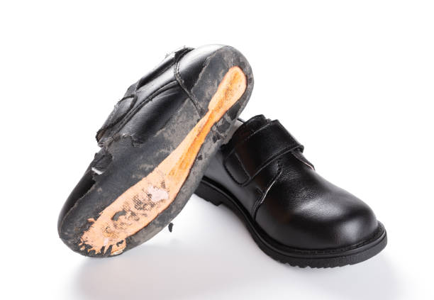 istock pair of damaged old one on white 985464214