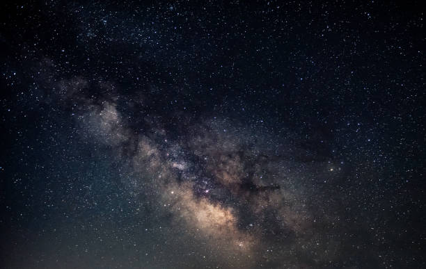 istock Milky Way on the starry night sky 985464224