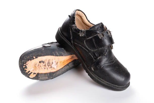 istock pair of damaged old one on white 985464256