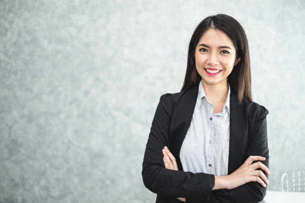 Portrait young beautiful asian business woman in formal suit in office stock photo