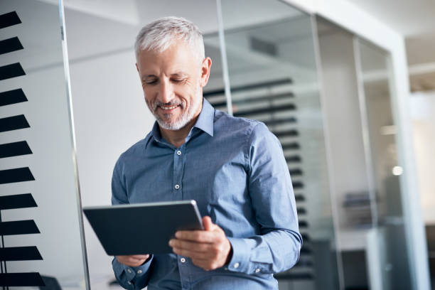 istock Now he can keep tabs on business wherever he goes 985498576
