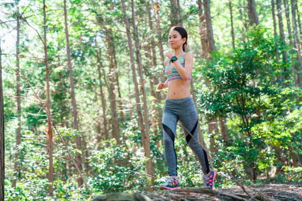 istock Woman running on trail in the mountains 985514504