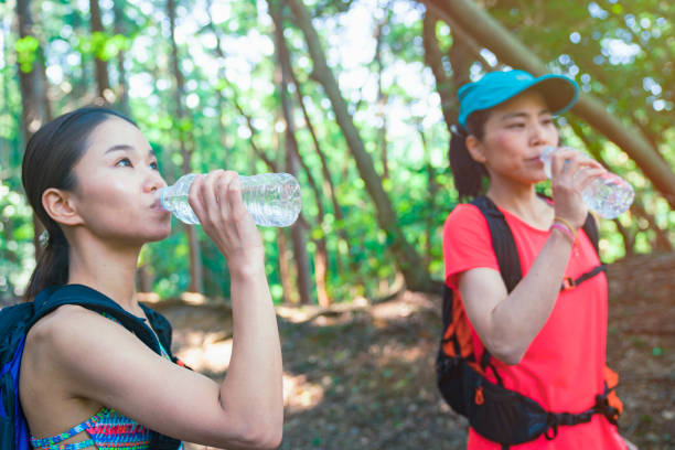 istock Two female hiker Walking around mountain 985514556