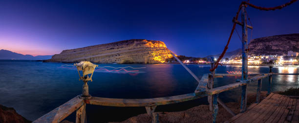 istock Beautiful Matala beach and cliff at night, Crete Island, Greece 985530902