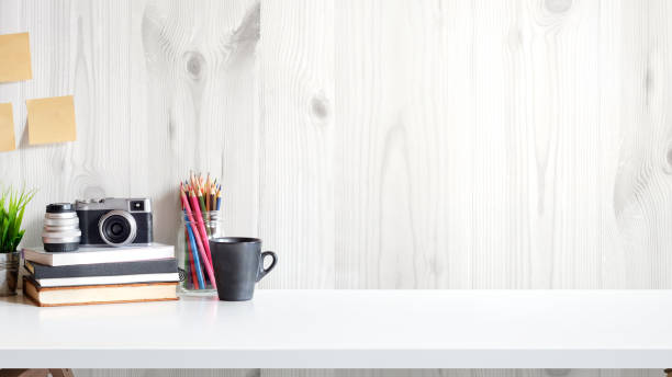 istock Desk with photographer equipment. Workspace and copy space. 985545382