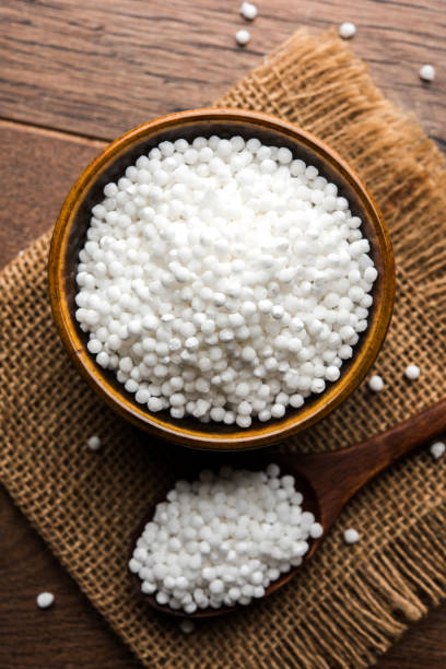 istock Sago or Sabudana served in a bowl over moody background. selective focus 985549214