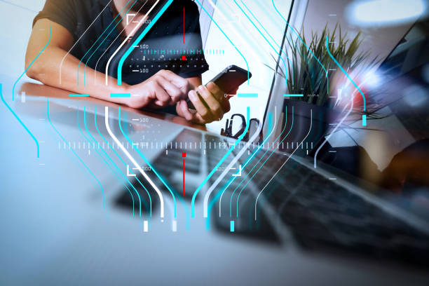 istock businessman hand working with new modern computer and smart phone and business strategy on wooden desk as concept 985560110
