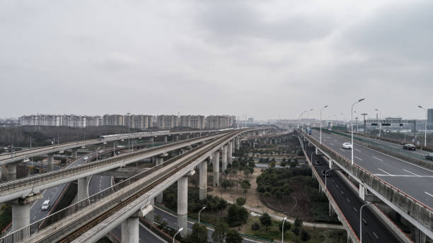 Aerial view of railway, highway and overpass on Luoshan road, Shanghai Aerial view of railway, highway and overpass on Luoshan road, Shanghai maglev train stock pictures, royalty-free photos & images