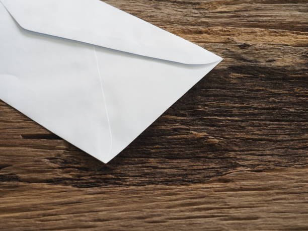 istock White envelope on old table In the business concept. Meaning, Resignation or Leave 985581486
