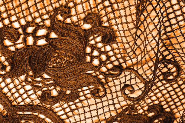 istock texture, pattern. fabric lace is golden, brownish-yellow. Shinning, shimmering and gorgeous! From extremely bright to elegant and classic, it's just an impressive lace 985582596