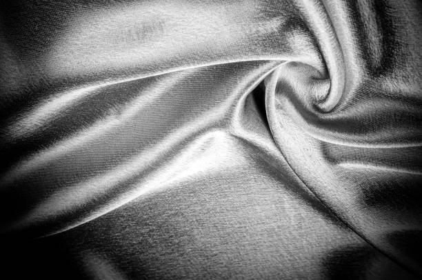 istock texture, pattern. Fabric made of silk fabric is black, This metallic black abstract jacquard is as magical as a mermaid under the water. The luminous metallic shade is mixed with the spray of color 985582784