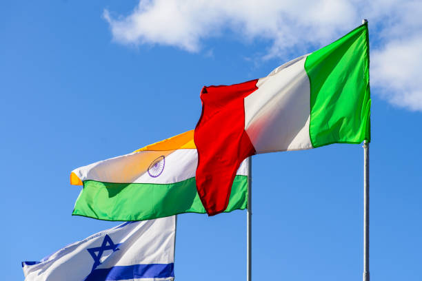 istock International summit. Flags of different countries blowing in th 985585736