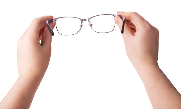 istock Female hands holding a pair of glasses 985587614