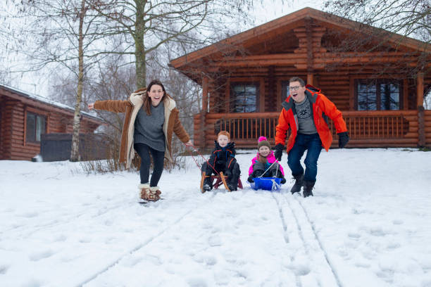 istock Sledding with their Family 985600838
