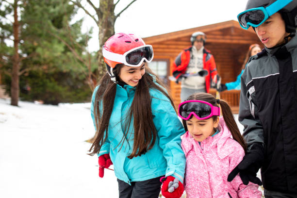 istock A Walk in the Snow with her Family 985601138