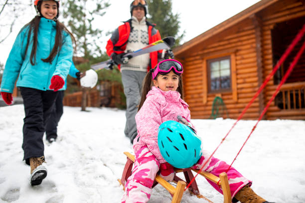istock Fun on the Sled with her Family 985601342