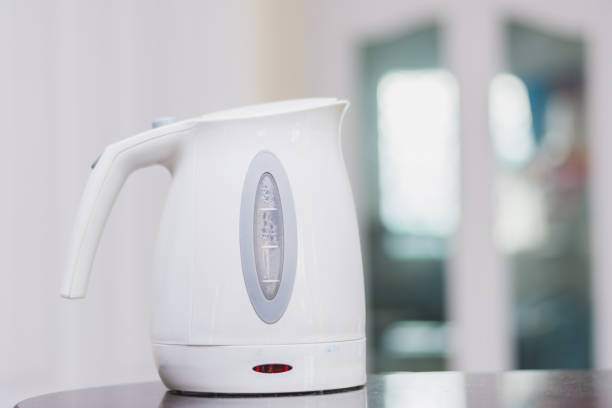 Electric plastic kettle on a granite counter top