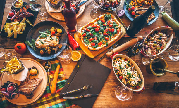 istock Different food cooked on a wooden table 985607188