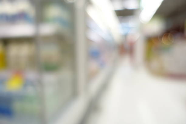 istock supermarket in abstract blurred background, lens blur effect 985607352