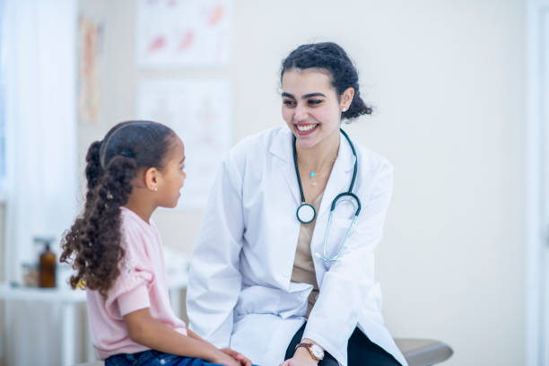 istock Girl With A Doctor 985627390