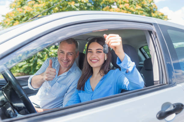 istock Young woman delighted having just passed her driving test 985627868