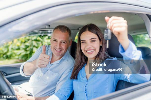 Young Woman Delighted Having Just Passed Her Driving Test Stock Photo - Download Image Now