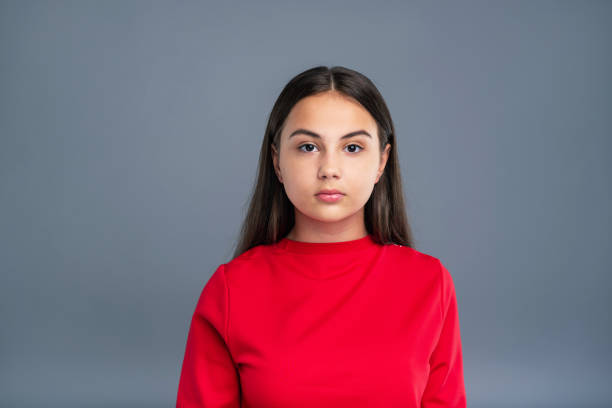 istock Portrait of a chubby dark-haired girl in red pullover 985628094