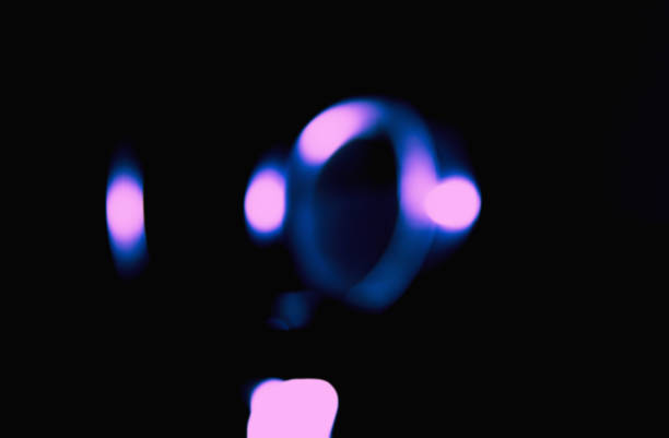 istock Ray of lamp spot light lens over black background, abstract illumination 985628276