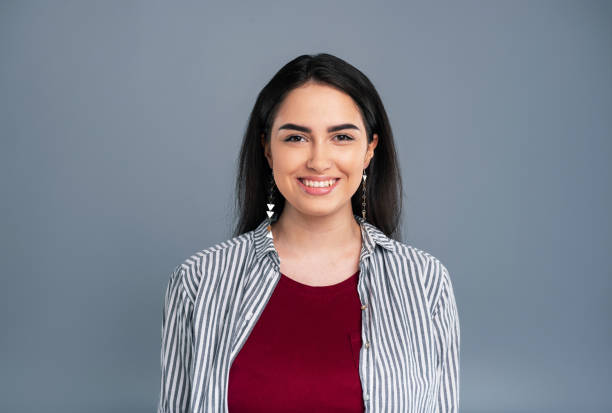 istock Beautiful young woman posing and smiling prettily 985628806