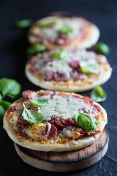 istock Mini pizzas with pepperoni and cheese 985629388