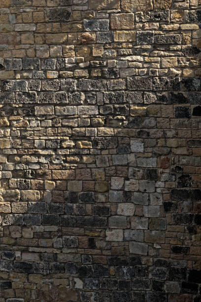 istock A stone-brick weathered wall in the Olot 985639928