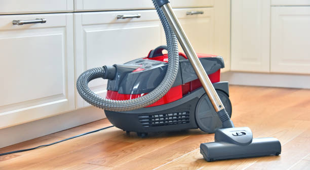 Canister vacuum cleaner for home use on the floor Canister vacuum cleaner for home use on the floor in the apartment. canister photos stock pictures, royalty-free photos & images