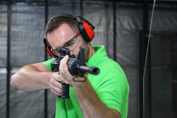 istock Shooting range.The man shoots from the rifle. 985650132