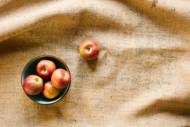 istock a bowl of fresh organic apples on fabric sack 985655876