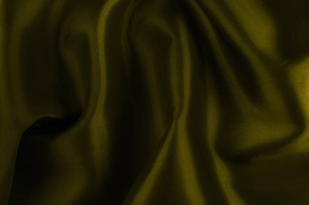 istock Soft focus. texture, pattern. cloth silk yellow. Mustard washed Silk Crepe de Chine. Bright mustard fabric is an ultra soft, silky hand. As the drapery folds, create sites, your designs, much more! 985663976
