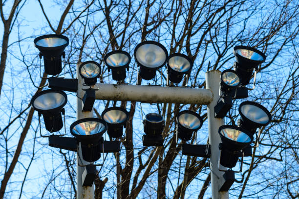 istock Close-up of spotlights on tree and sky background 985672456