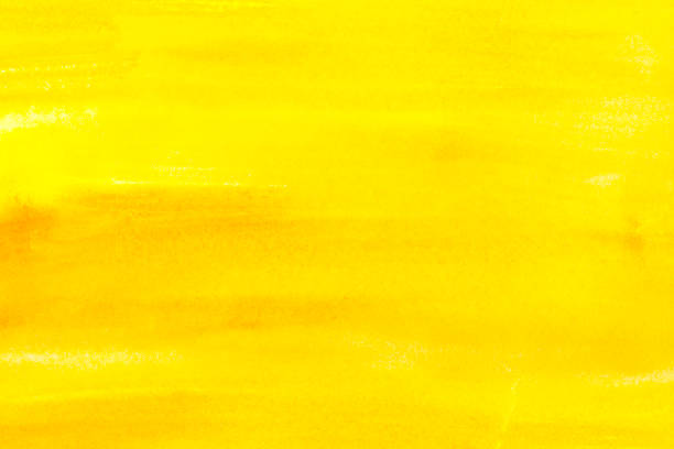 istock Abstract painting with bright yellow paint strokes, full frame 985673568