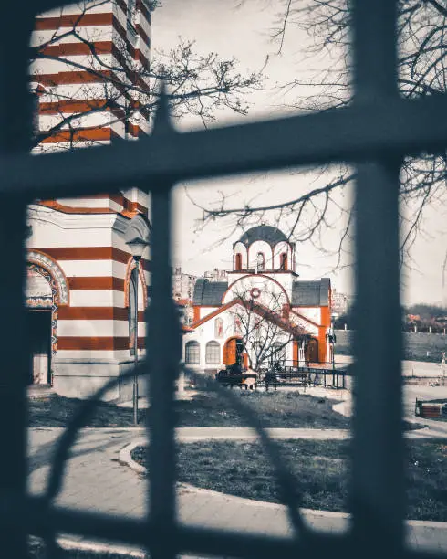 One of the most beautiful churches in the city of Nis, Serbia, shot through the fence. Shot taken on 35mm film.