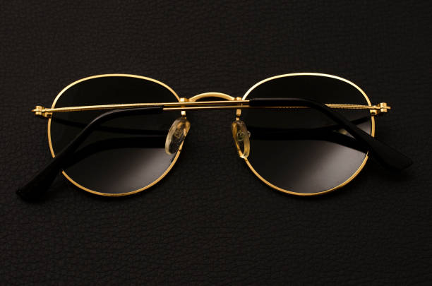 istock round sunglasses isolated on black 985713242