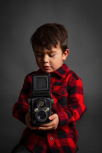 Great quality photos of a Child with a camera, future Photographer.