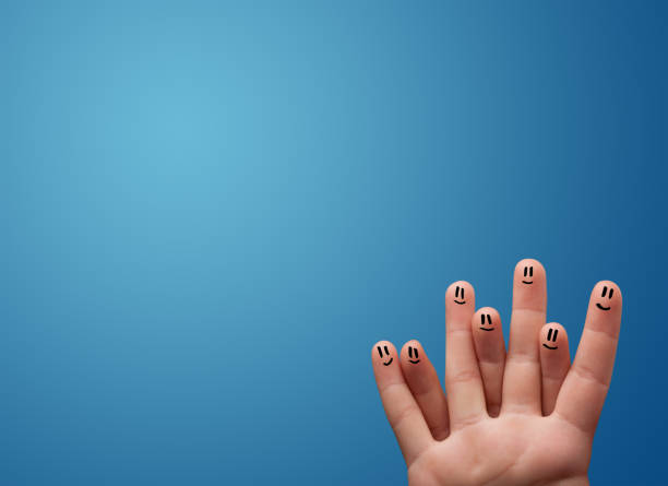 A soft focus image of a woman holding her hand up to block the sunlight in an outdoor garden. The bright sunlight filters through the green foliage of trees, and the woman’s hand is raised as a shield against the intense light.
