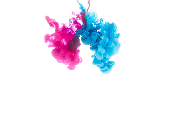istock mixing of blue and pink paint splashes isolated on white 985759048