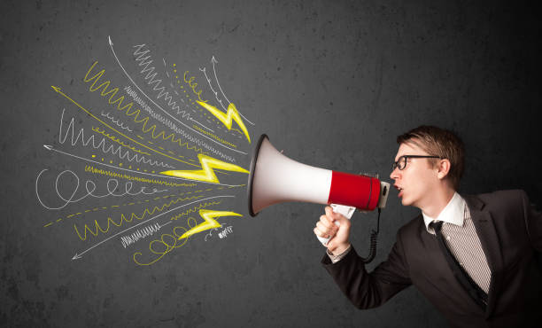 istock Leader guy shouting into megaphone with hand drawn lines and arrows 985761434