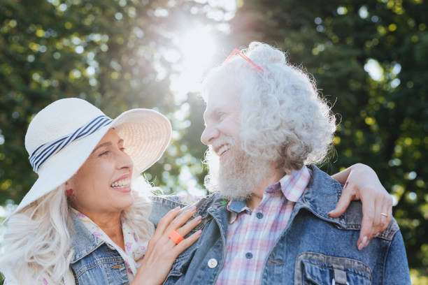 istock Nice aged woman hugging her husband 985763824