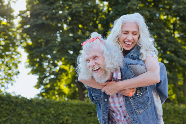 istock Delighted positive man holding his wife 985773256