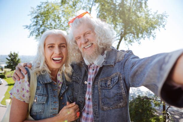 istock Happy elderly couple taking selfies 985779446