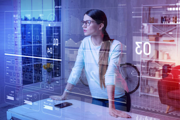 istock Attentive woman putting her hands on the table and looking at the screen 985781746