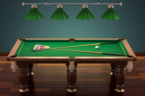 istock Billiard table with balls and cue in room 985791682